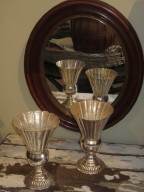 Silver vases and mohogany mirror